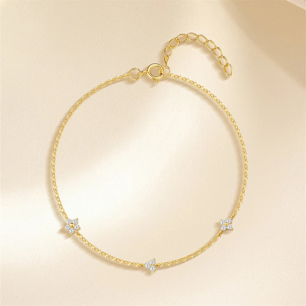 Pulsera AIDE de plata 925 con circonita, cruz, flor y perla barroca