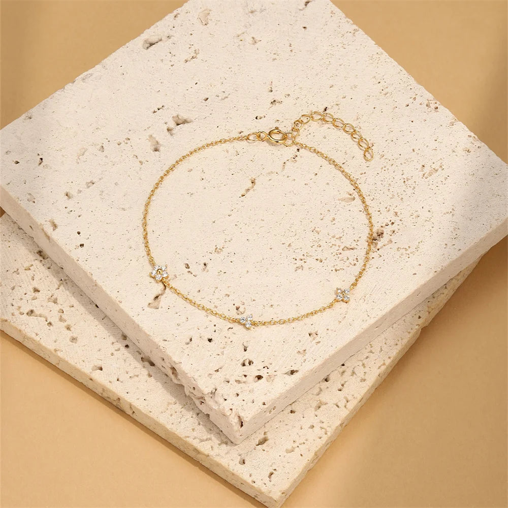 Pulsera AIDE de plata 925 con circonita, cruz, flor y perla barroca
