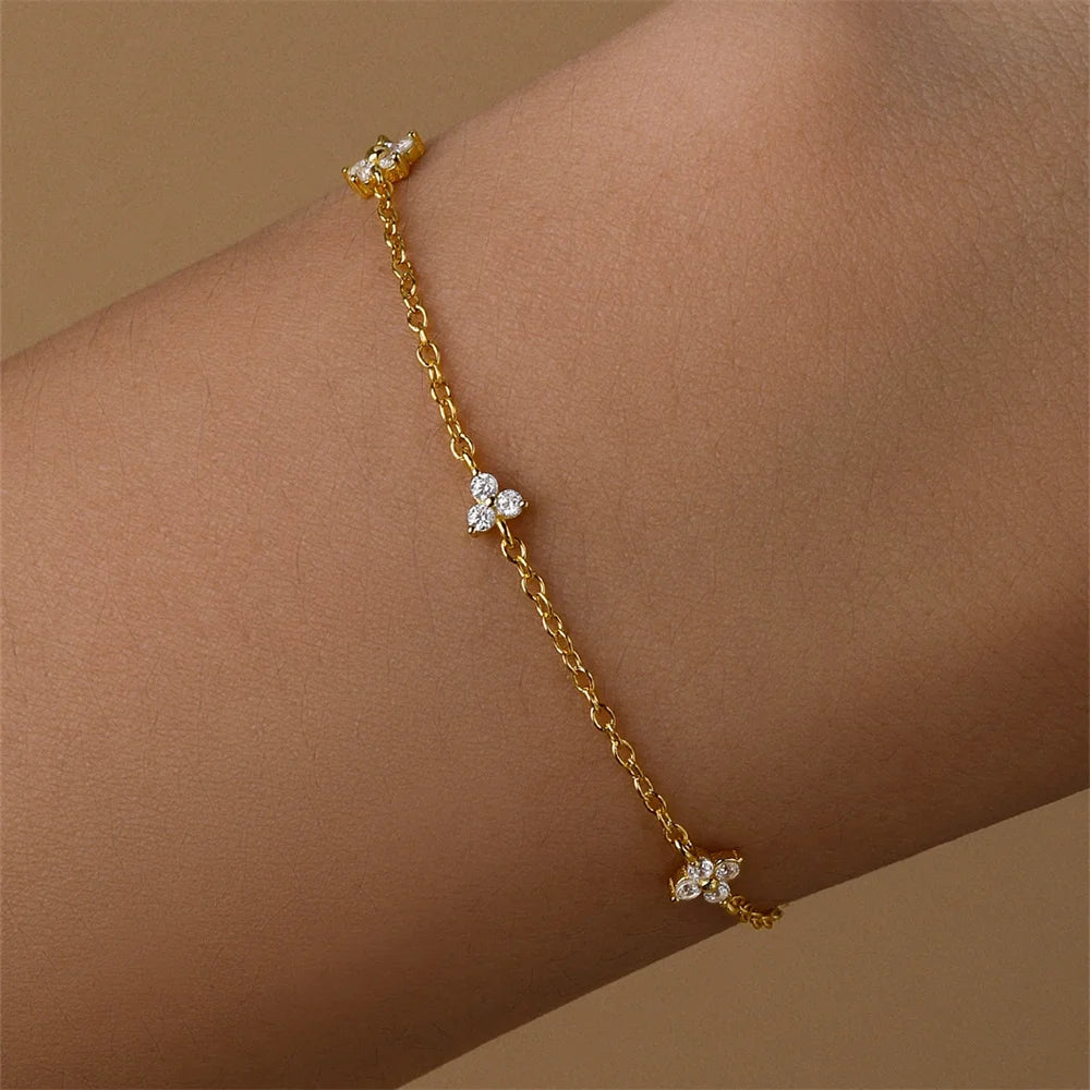 Pulsera AIDE de plata 925 con circonita, cruz, flor y perla barroca
