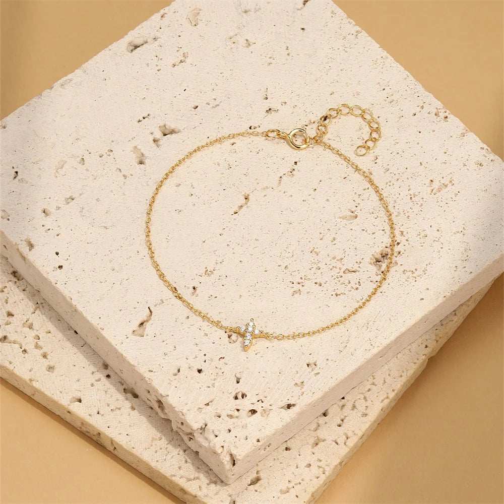 Pulsera AIDE de plata 925 con circonita, cruz, flor y perla barroca