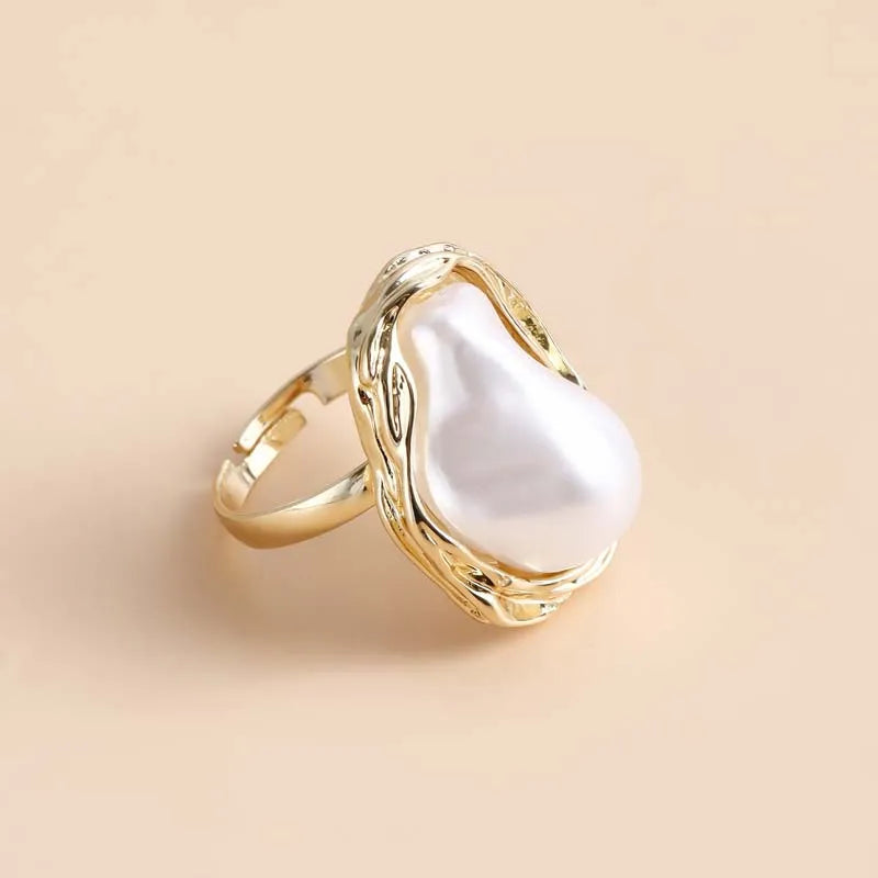 Anillo abierto vintage con perla blanca e incrustación de estrella de mar 2025